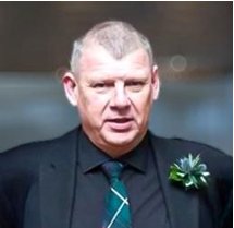 A person in a suit and tie

AI-generated content may be incorrect.